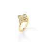 Side view of yellow gold, mother of pearl, and diamond floral ring on a white background