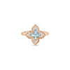 Gold ring featuring a four-petal flower design with a center blue gemstone surrounded by pavé diamonds.