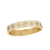 The VENETIAN PRINCESS DIAMOND AND WHITE ENAMEL FLOWER BANGLE by Roberto Coin showcases white enamel, diamond floral motifs, intricate 18K yellow gold detailing, and a hinged clasp, inspired by the brand’s Venetian Princess collection.