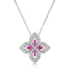 White gold necklace with pave diamond flower pendant featuring pink sapphire center accents on a white background.