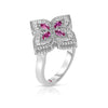 Side view of a white gold with pave diamond flower ring featuring pink sapphire center accents on a white background.