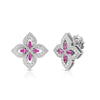 White gold pave diamond flower stud earrings featuring pink sapphire center accents on a white background.