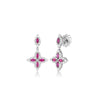 White gold, diamond, and ruby floral drop earrings on a white background