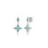 White gold, diamond, and emerald floral drop earrings on a white background