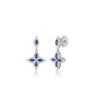 White gold, diamond, and blue sapphire floral drop earrings on a white background