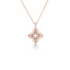 The VENETIAN PRINCESS PIROUETTE PAVE SMALL FLOWER NECKLACE by Roberto Coin features an 18K rose gold four-petal flower pendant with pave diamonds, delicately suspended from a fine chain against a white background.