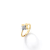 The LOVE IN VERONA DIAMOND FLOWER RING by Roberto Coin is an 18K gold ring featuring a four-petal diamond flower, shown on a white background with a soft shadow.