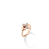 The LOVE IN VERONA DIAMOND AND RUBELLITE SPLIT FLOWER RING by Roberto Coin showcases a stunning split flower design in 18K rose gold with diamonds and rubellite gems, set against a white background with a soft shadow.