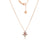The Roberto Coin LOVE IN VERONA PAVE DIAMOND AND RUBELLITE SPLIT FLOWER NECKLACE features an 18K rose gold floral pendant with pavé diamonds and a central rubellite, shown with its matching chain and flower charm against a white background.