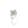 The LOVE IN VERONA MEDIUM PAVE DIAMOND FLOWER RING by Roberto Coin is a silver ring with a diamond-encrusted flower design and two 18K gold accents at the center, shown on a white background.