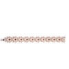 The TIARE' Diamond, Rubellite, and Mother of Pearl Flower Bracelet by Roberto Coin features repeating floral motifs with rubellite centers, diamond accents on each petal, and a luminous white mother of pearl background.