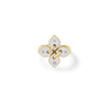 The LOVE IN VERONA SMALL DIAMOND AND ENAMEL FLOWER RING by Roberto Coin features a butterfly-shaped gold design with four white enamel segments and diamond accents, displayed on a simple gold band against a white background.