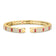Yellow gold cuff bangle with pave diamond and ruby on a white background