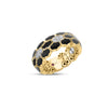 Side view of yellow gold and black enamel ring with white gold diamond accents on a white background