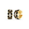 Yellow gold and black enamel open back hoop earrings with white gold and diamond accents on a white background