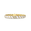 Yellow gold and white enamel link bracelet with diamond accents on a white background