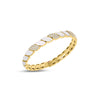 Yellow gold and white enamel cuff bangle with diamond accents on a white background