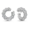 White gold curled earrings with pave diamond finish on a white background