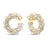 Yellow gold and white enamel curled earrings with white gold and diamond accents on a white background