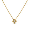 Yellow gold necklace with a single diamond accent in a square bezel on a white background