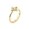 Side view of yellow gold ring with a single diamond accent in a square bezel on a white background