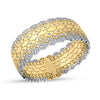 Yellow and white gold cuff bangle with scattered diamond accents on a white background