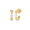 Yellow gold and white enamel open back hoop earrings with diamond accents on a white background