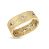 Yellow gold bangle bracelet with pave diamond flowers and scattered diamond accents on a white background