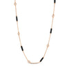 Rose gold necklace with alternating black enamel bar and diamond bezel stations on a white background