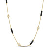 Yellow gold necklace with alternating black enamel bar and diamond bezel stations on a white background