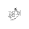 Side view of white gold triple flower ring with pave diamonds on a white background