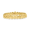 Yellow gold bracelet with diamond accents on a white background