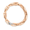 Rose gold link chain bracelet with single white gold and pave diamond link on a white background