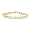 Yellow gold and white enamel link bracelet with diamond accents on a white background