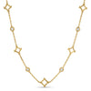 Yellow gold necklace with open frame and diamond stations on a white background