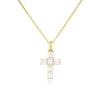 Yellow gold cross-shaped pendant necklace with emerald cut diamonds on a white background