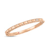 The ART DECO MOSAIC DIAMOND ACCENT BANGLE by Roberto Coin is a rose gold geometric bangle with pavé diamonds and a discreet red gemstone accent on the inner band.
