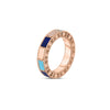 The ART DECO MOSAIC ALTERNATING BLUE LAPIS, DIAMOND, AND TURQUOISE RING by Roberto Coin features 18K rose gold with a textured band, alternating lapis and turquoise inlays, and diamond accents. Shown on a plain white background.
