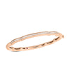 The CIALOMA DIAMOND CLOUD BANGLE by Roberto Coin features a smooth, slightly segmented rose gold design with a row of sparkling diamonds, elegantly crafted in 18K gold for a refined look.