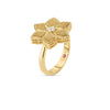 The VERNAZZA DIAMOND AND SATIN FINISH FLOWER RING by Roberto Coin is crafted in 18K yellow gold with textured petals, a central diamond, and a hidden red gemstone inside the band.
