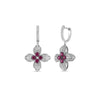 The LOVE IN VERONA DIAMOND AND RUBY FLOWER EARRINGS by Roberto Coin feature 18K white gold flower drops, petals adorned with sparkling diamonds, and a vivid ruby cluster—an exquisite example of fine jewelry.