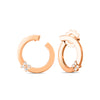 The LOVE IN VERONA SINGLE DIAMOND FLOWER CIRCLE EARRINGS by Roberto Coin feature a delicate floral circle design in rose gold with sparkling diamonds, displayed against a white background.