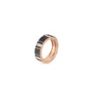 The OBELISCO PAVE BLACK AND WHITE DIAMOND RING by Roberto Coin features alternating pavé white and black diamonds in rectangular sections of rose gold, elegantly set against a plain white background.