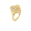The Roberto Coin PALAZZO DUCALE CARNIVAL DIAMOND AND POLISHED FINISH FLOWER RING is crafted in 18K yellow gold with a detailed floral motif, featuring a central round diamond and a small pink stone, shown on a white background.