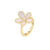 The JASMINE DIAMOND AND MOTHER OF PEARL FLOWER RING by Roberto Coin features five pale pink petal-shaped mother-of-pearl inlays and a central diamond, all set in elegant 18K yellow gold against a plain white background.
