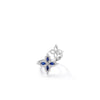 The DIAMOND PRINCESS OUTLINE TAPERED FLOWER BYPASS RING by Roberto Coin showcases two floral motifs—one adorned with blue and white stones, the other in delicate openwork—elegantly crafted in silver.