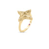 The STARDUST SMALL OPEN FRAME DIAMOND STAR RING by Roberto Coin features a star-shaped 18K yellow gold design with layered details, sparkling diamonds at each point, and a tiny pink gemstone set in the band against a plain white background.