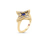 The Roberto Coin STARDUST SMALL DIAMOND AND BLUE CERAMIC STAR RING features a dazzling five-pointed star with blue ceramic center and diamond accents on each tip, all set in elegant 18K yellow gold.