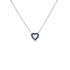 The Roberto Coin TINY TREASURES REVERSIBLE HEART NECKLACE features a delicate silver chain and a small heart pendant with dark blue gemstones, shown centered on a plain white background.