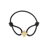 The VENETIAN PRINCESS DIAMOND FLOWER SILK BRACELET by Roberto Coin features a black silk band and a central gold flower charm with a cross cutout, displayed on a white background.